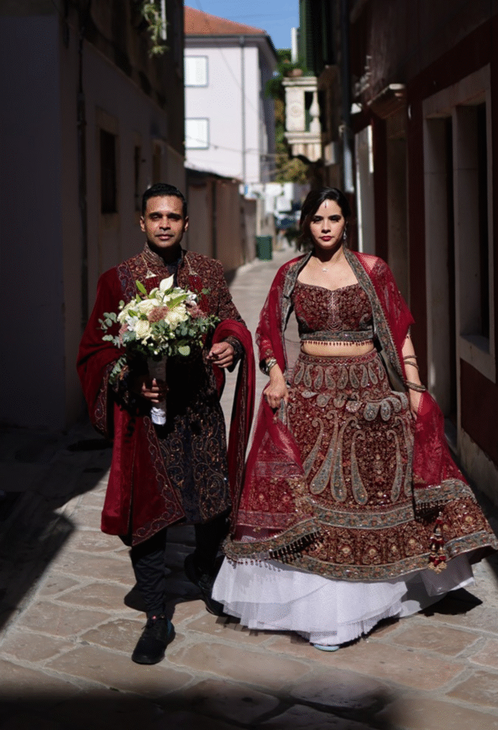 Groom and Bride in red maharaja sherwani and lehenga