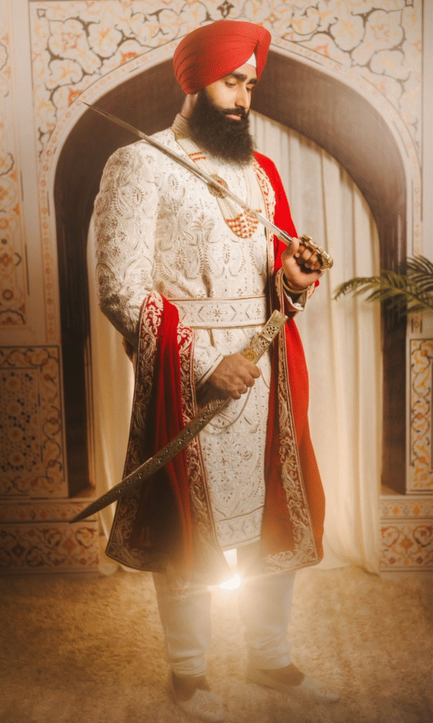 Groom in Maharaja Sherwani with Red Shawl and Traditional Red Turban