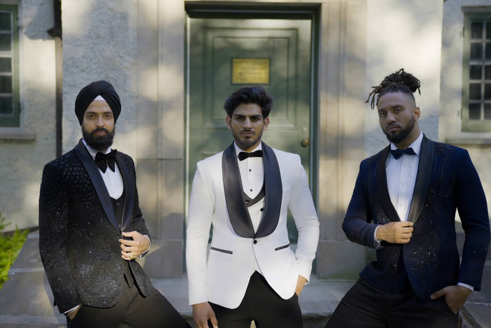 3 Grooms wearing tuxedos in white and black with embroidery